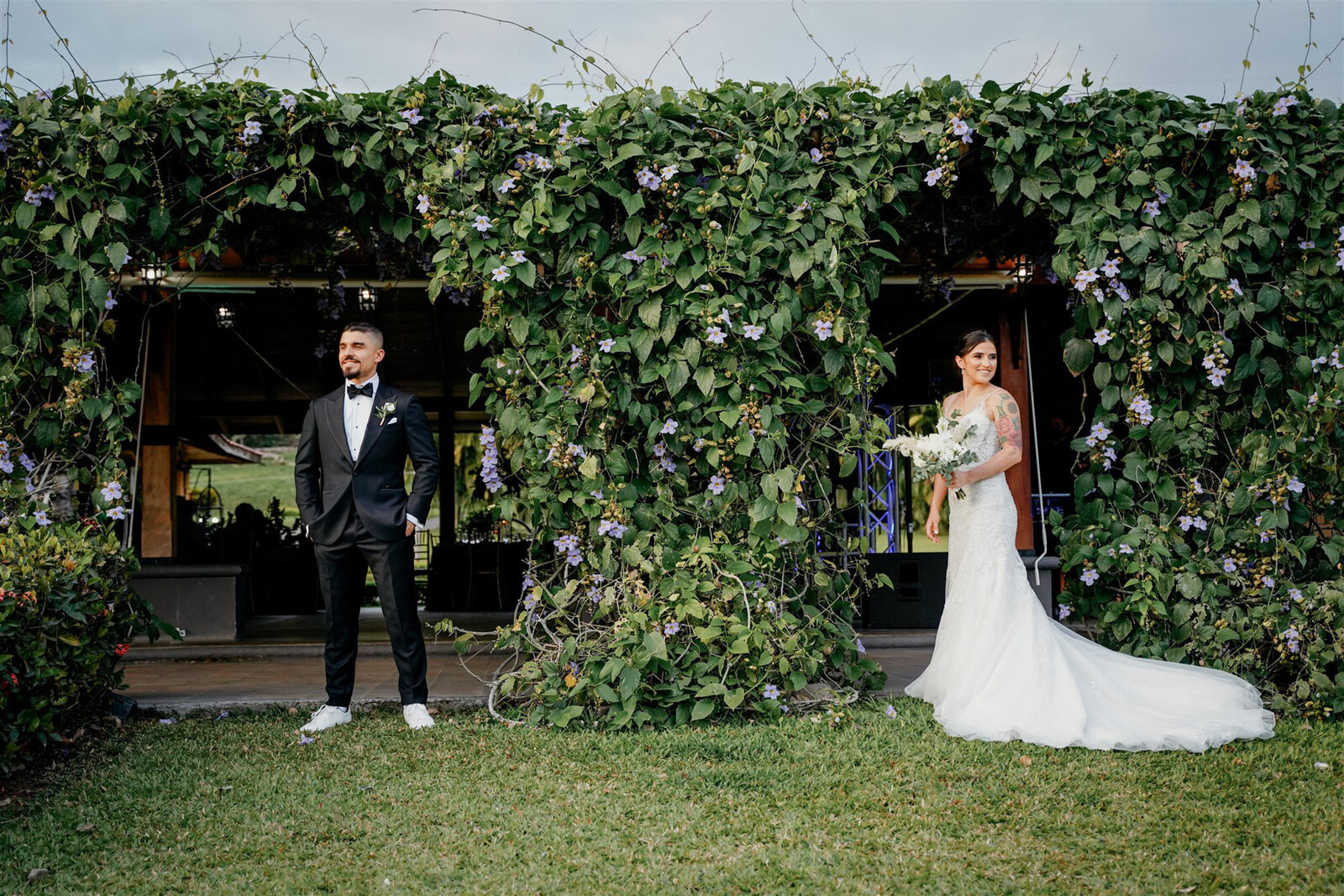 wedding couple in costa rica in front of greenery
