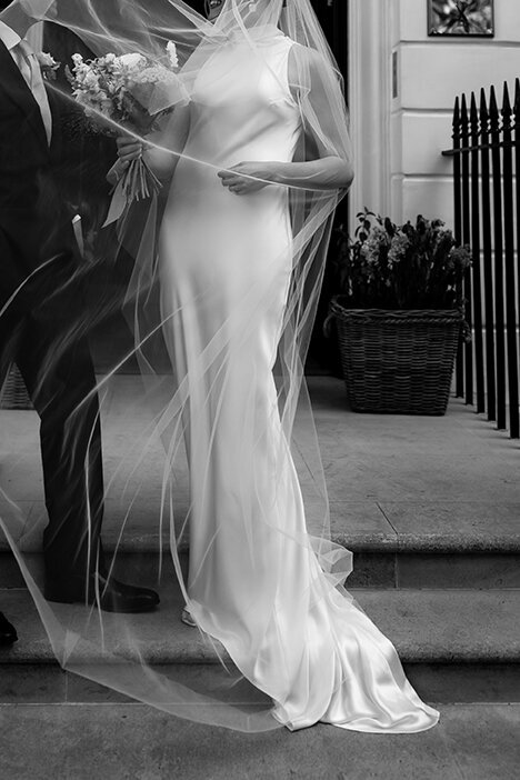 detail photo of a bride veil wrapped around her body at old marylebone town hall wedding