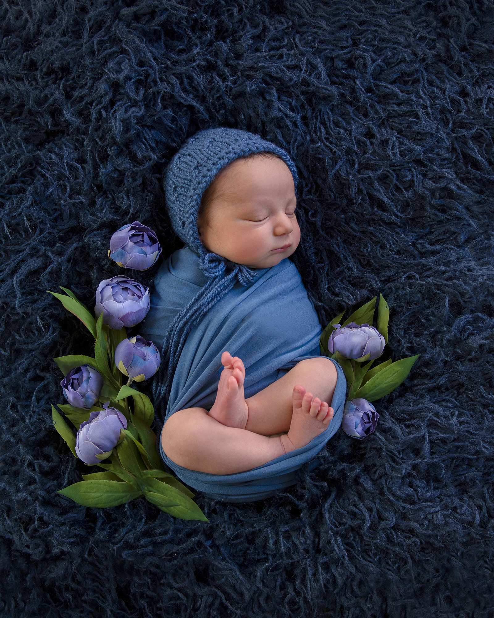 Newborn-Baby-girl-in-blue-and-flowers