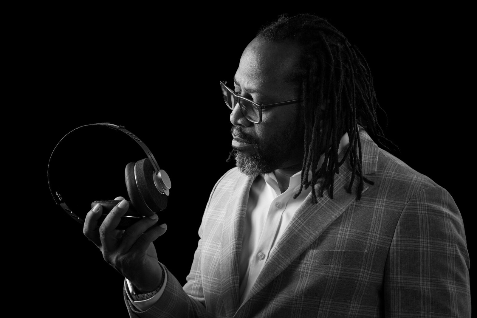 Chicago DJ Marz holding headphones in Chicago studio