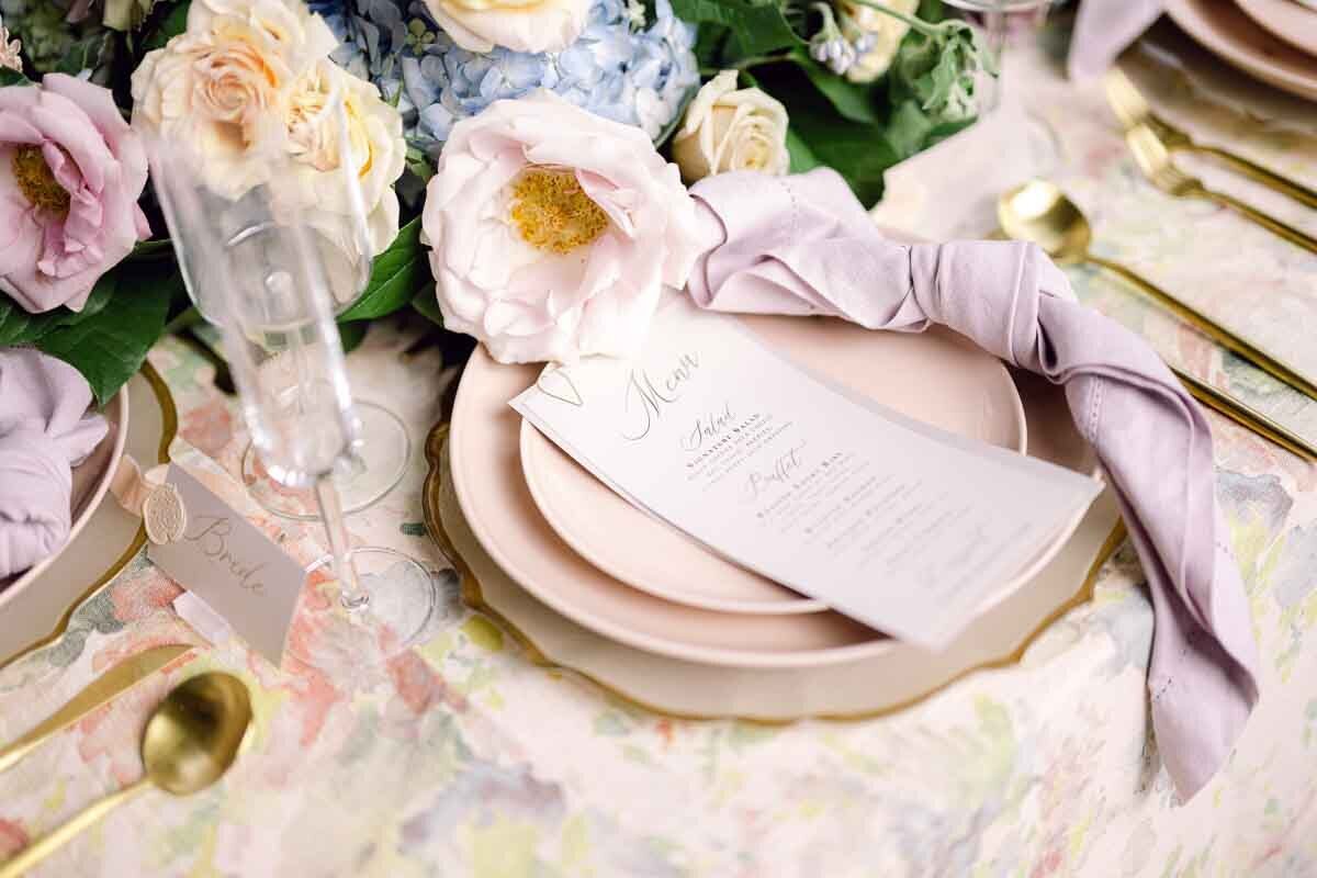 close up photo of wedding dining placement with menu