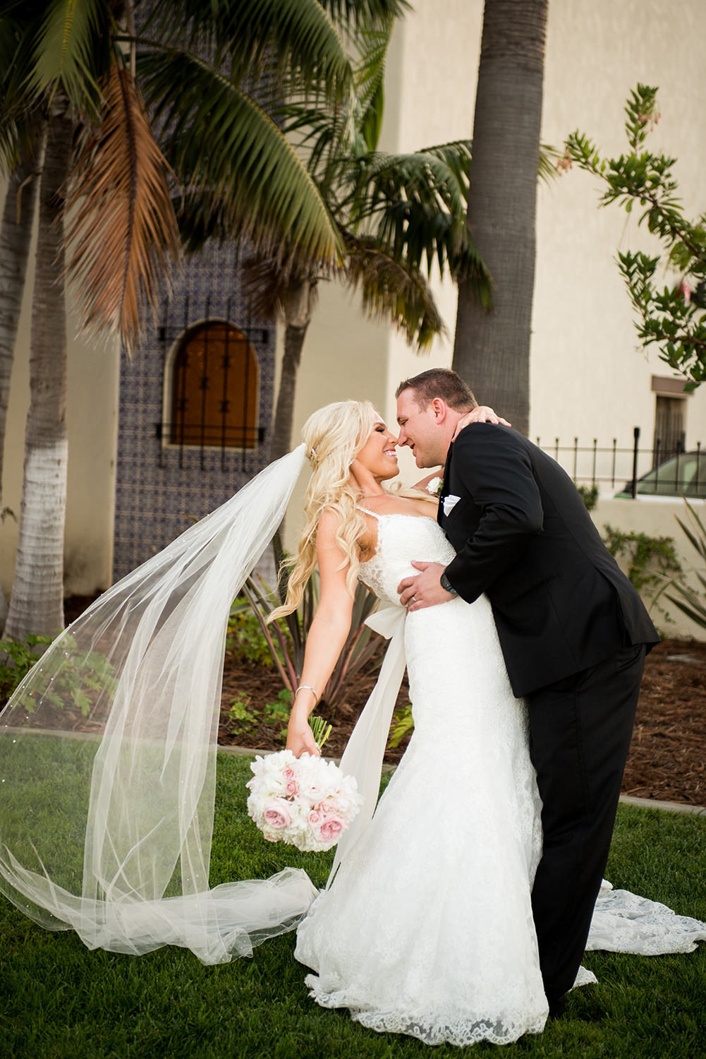 bride and groom laughing at each other