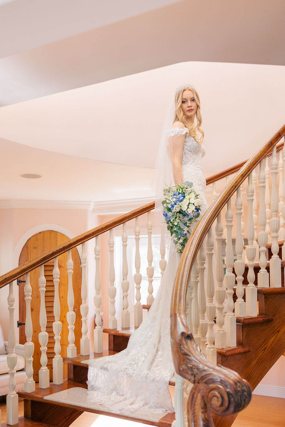 bride poses alone on stairwell