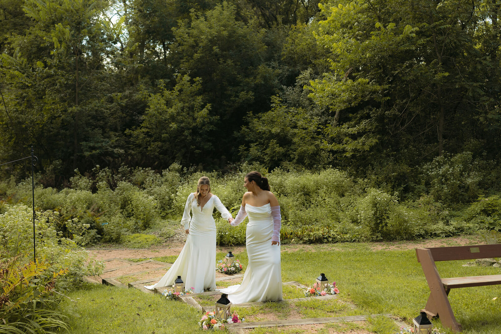 A couple holding hands in the woods
