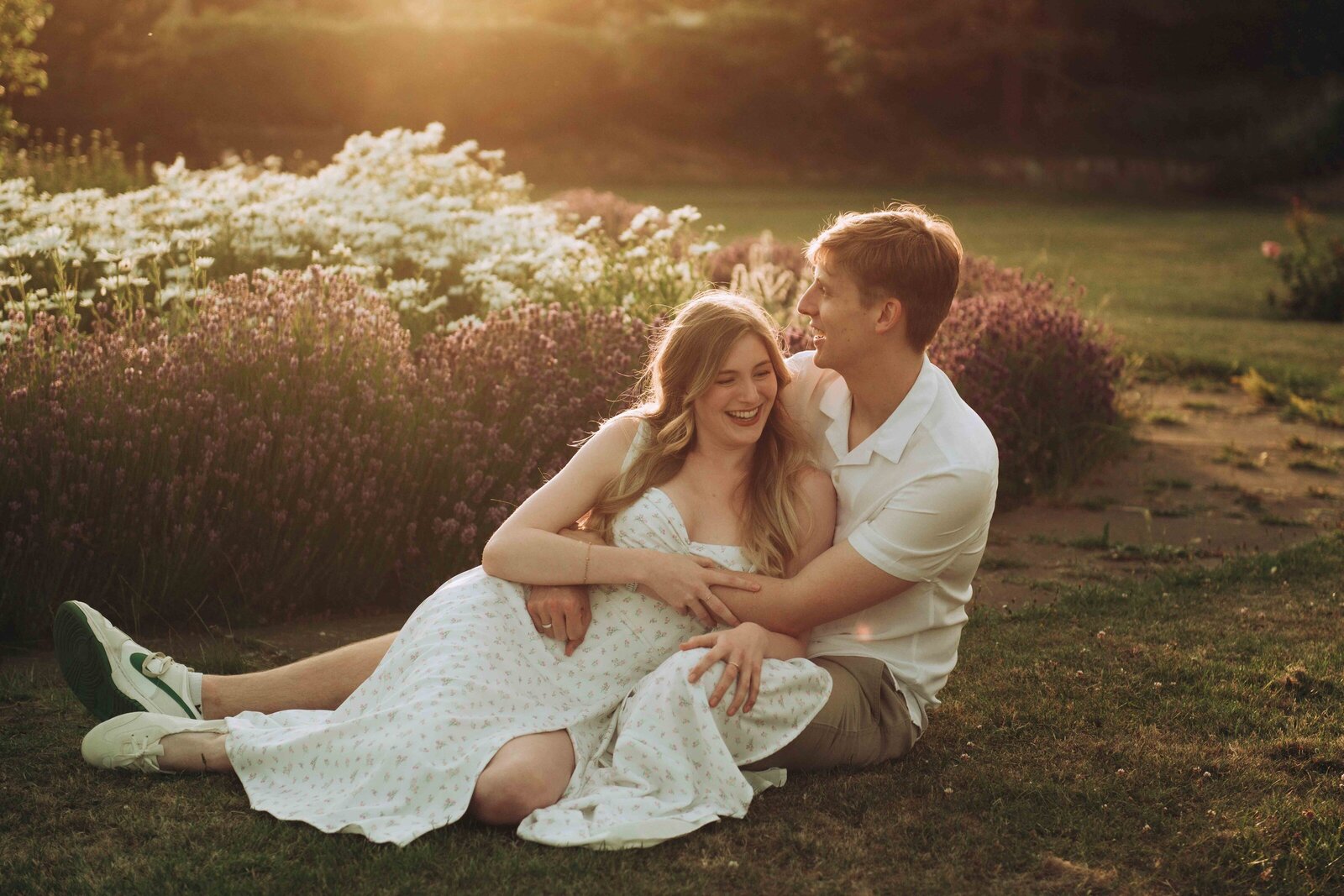 Loved up couple cuddling in a rose garden near Margate
