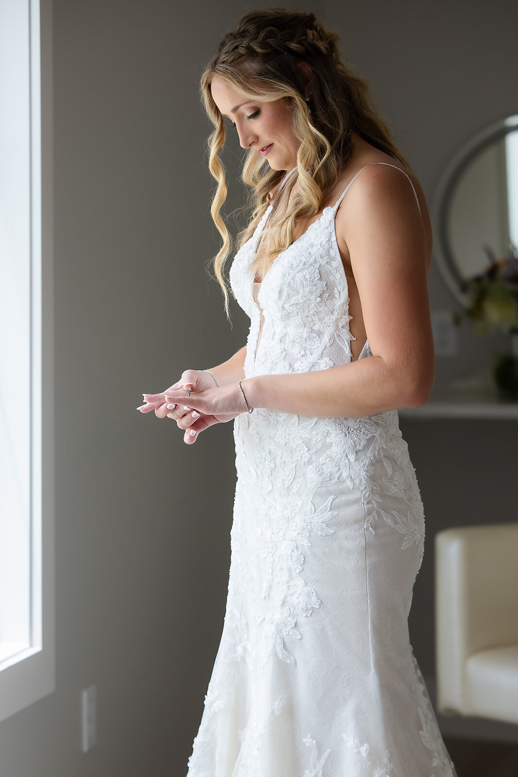bride looking at engagement ring