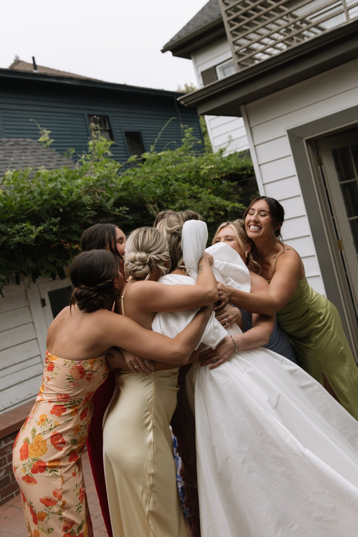 Bridal party embracing taken by destination wedding photographers Erica Rochelle Photography