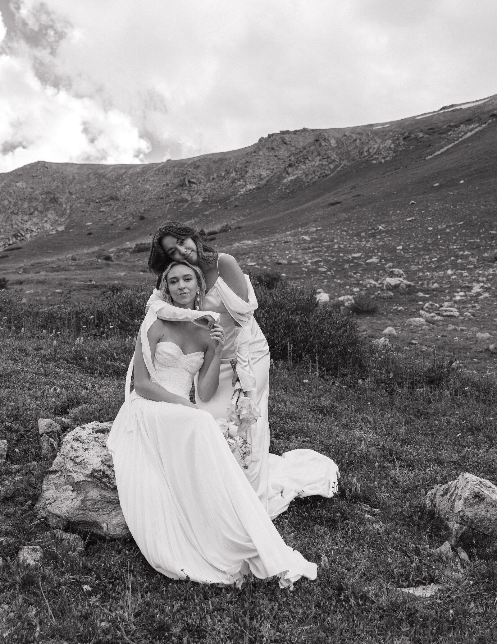 lesbian bridal couple hugging at destination elopement in Colorado 