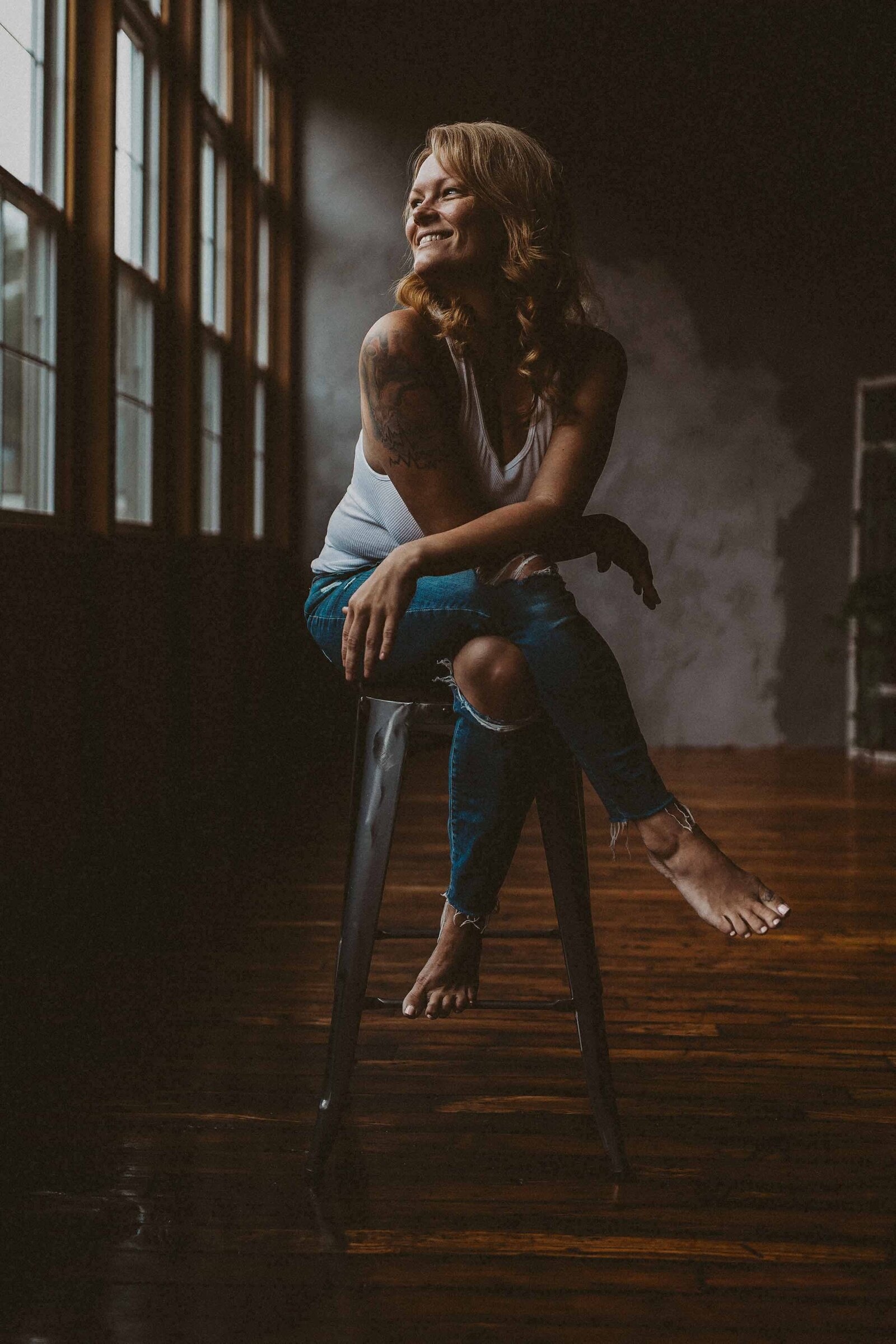 woman sitting on a long chair