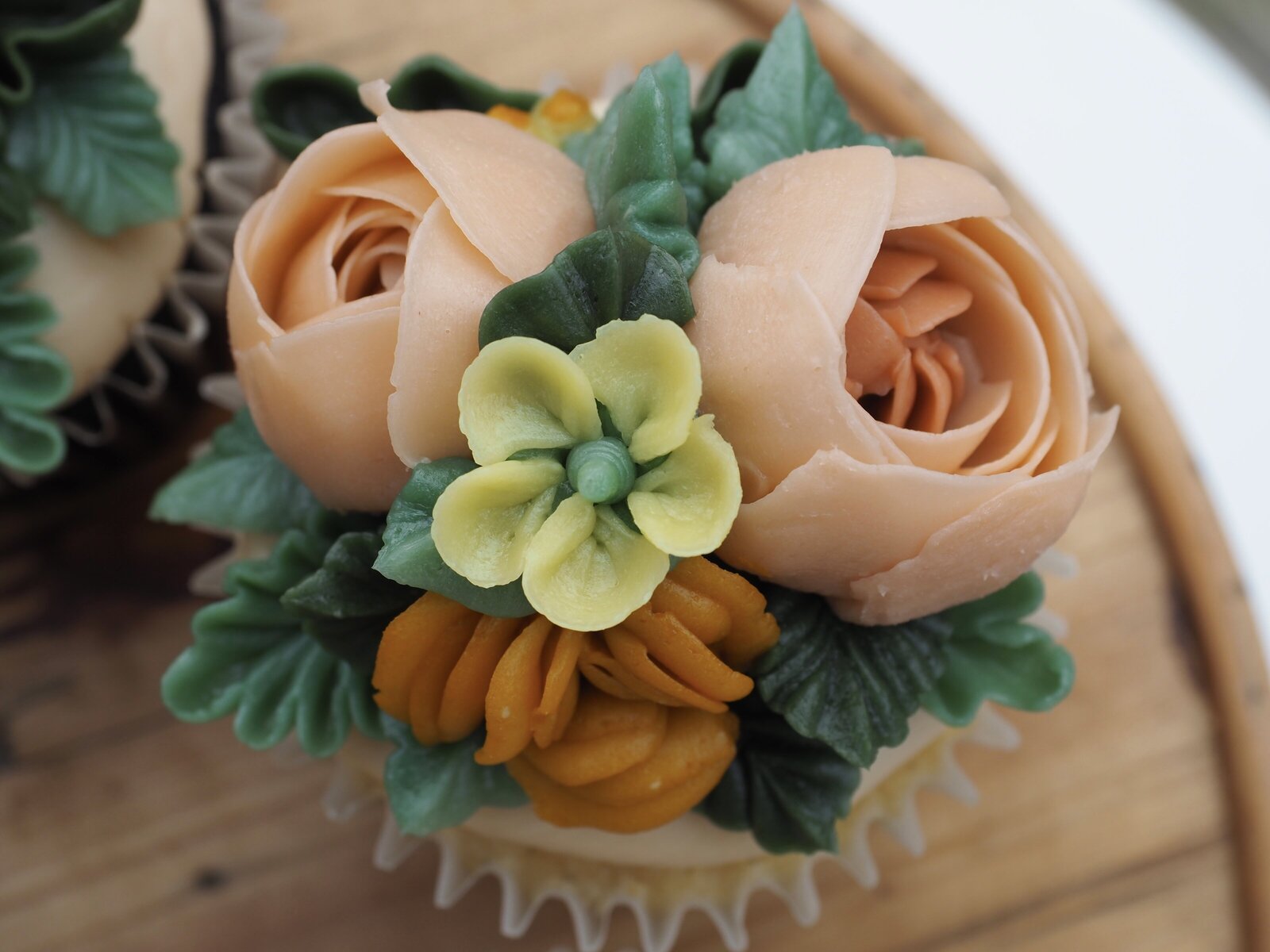 Close up of floral buttercream cupcake