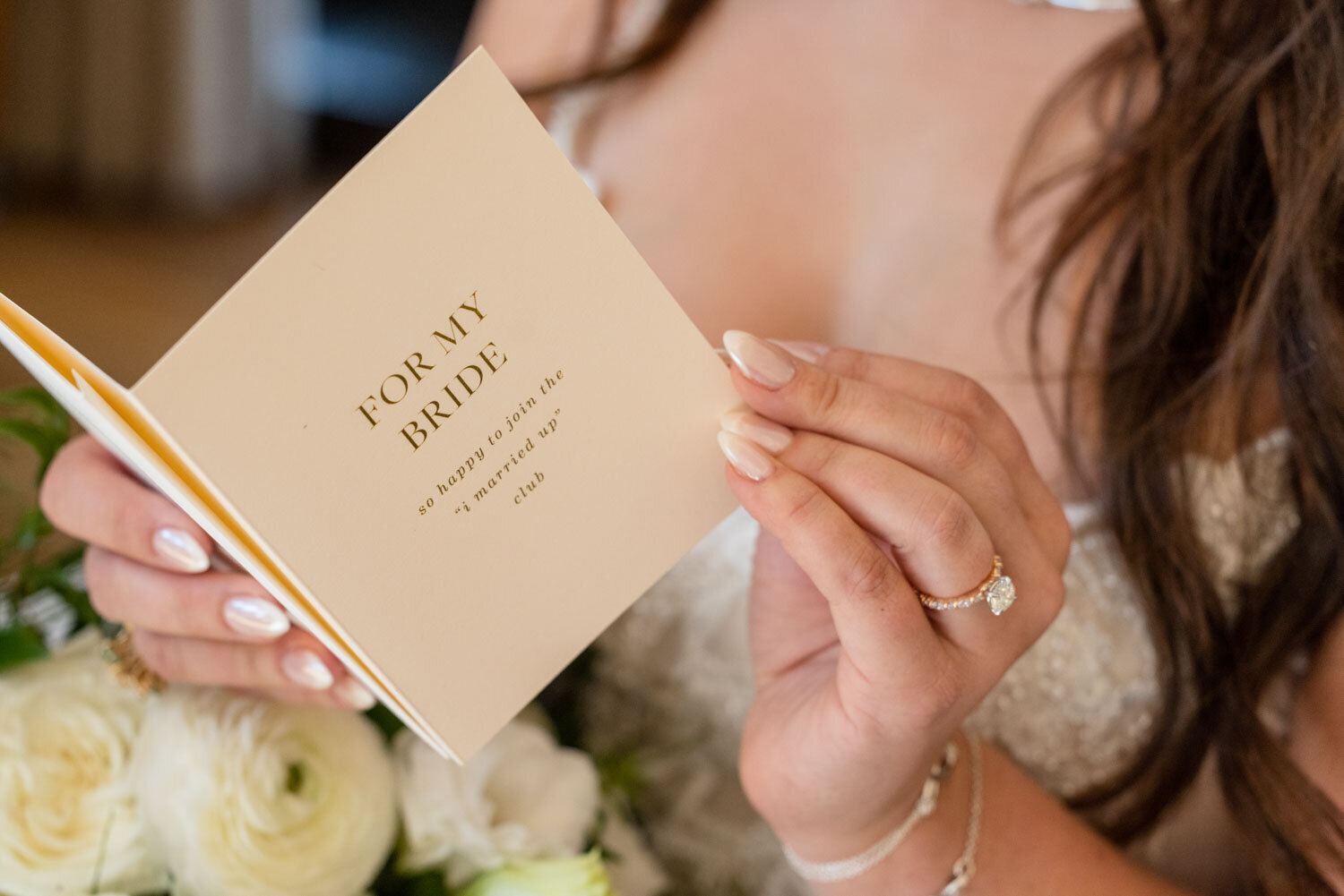 A woman is holding a book that says for my bride