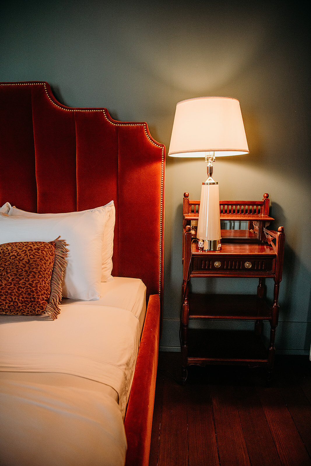 The Medina Suite features plush rust velvet headboard