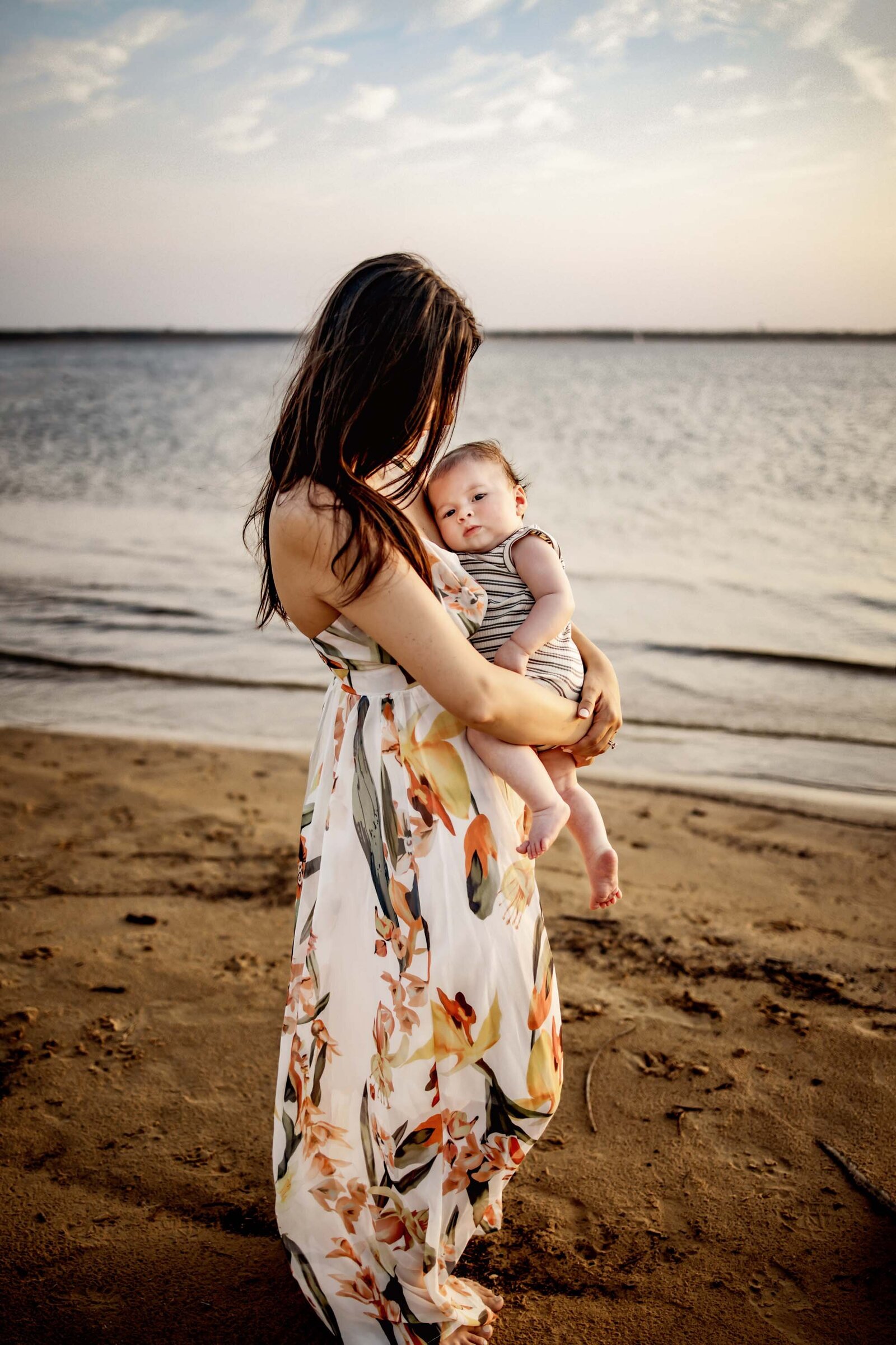 mother hold baby at the lake in flower mound texas