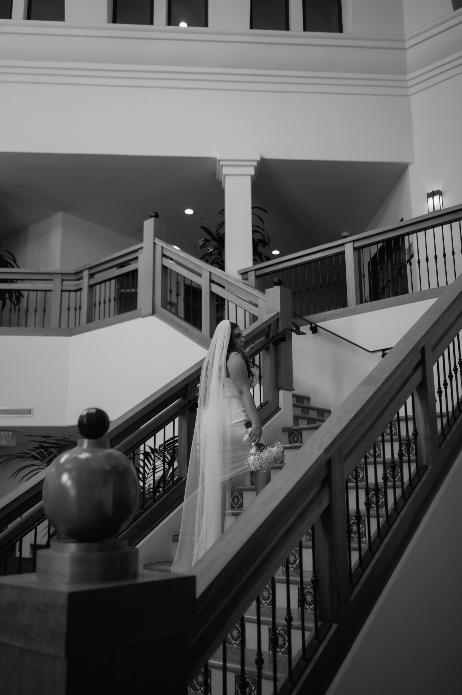 bride walking up stairs during wedding