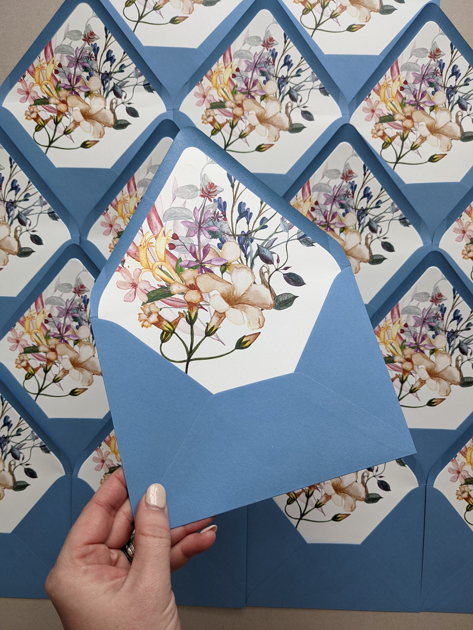 dusty-blue-envelopes-wedding-invitations-florals