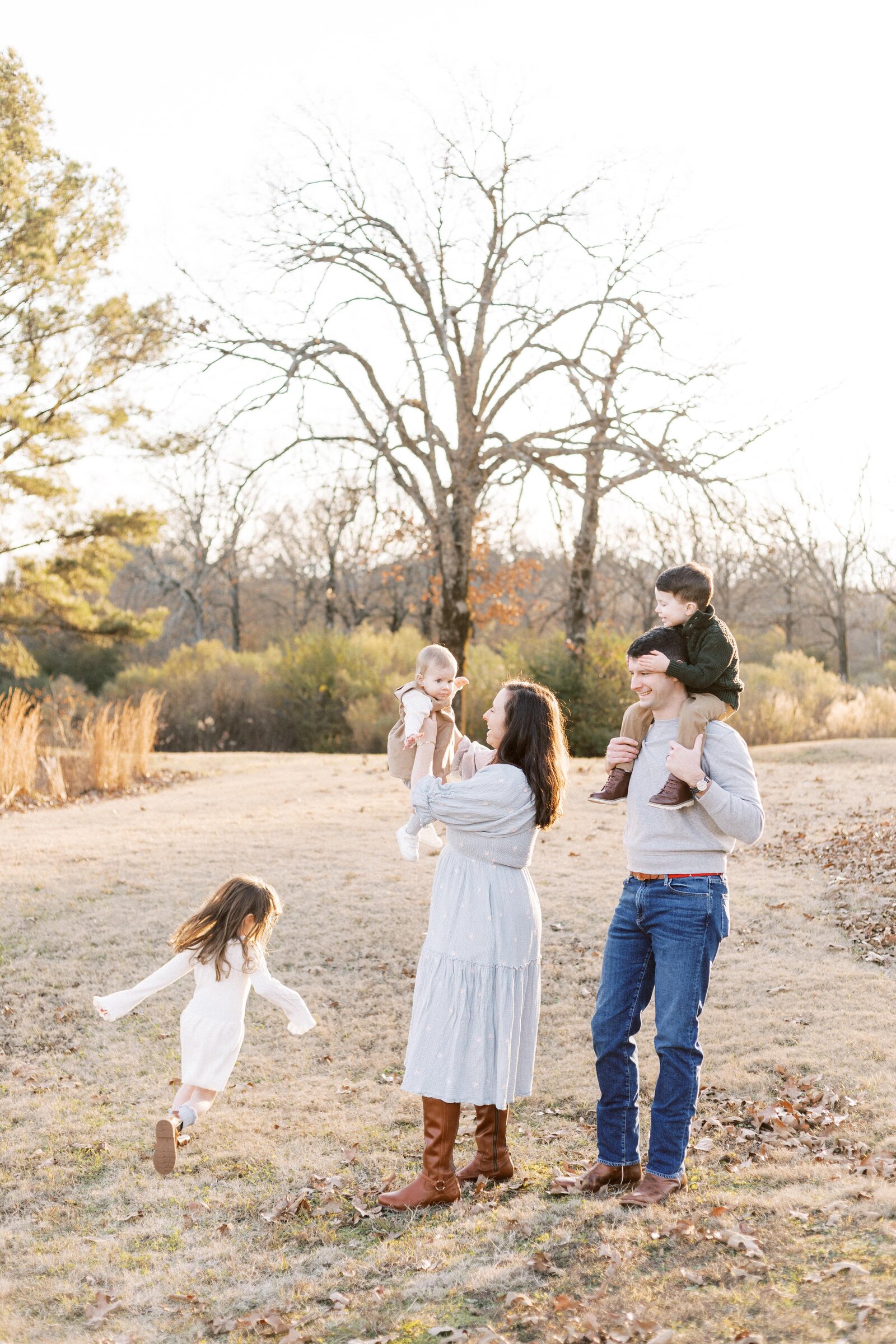 parents playing with kids during peoria illinois family photos 