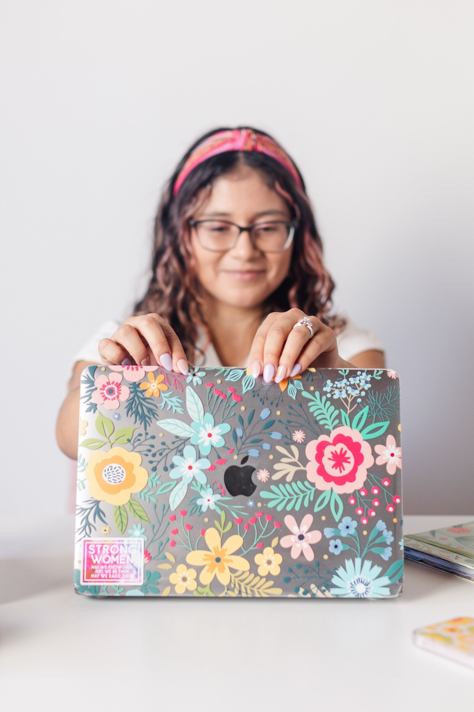 a woman opens her laptop