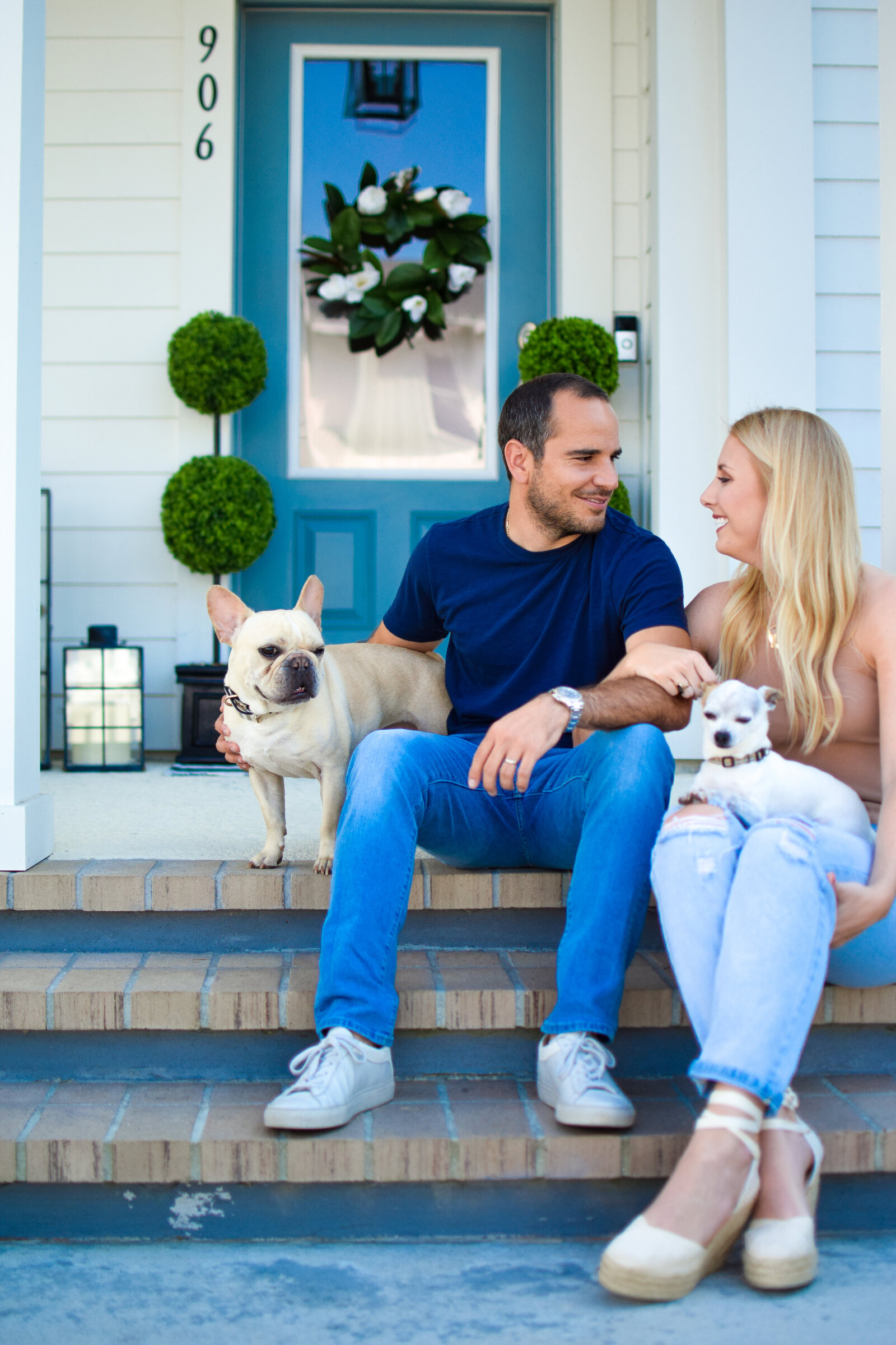 Couple & dogs blue door Front Porch Project Oakland Florida