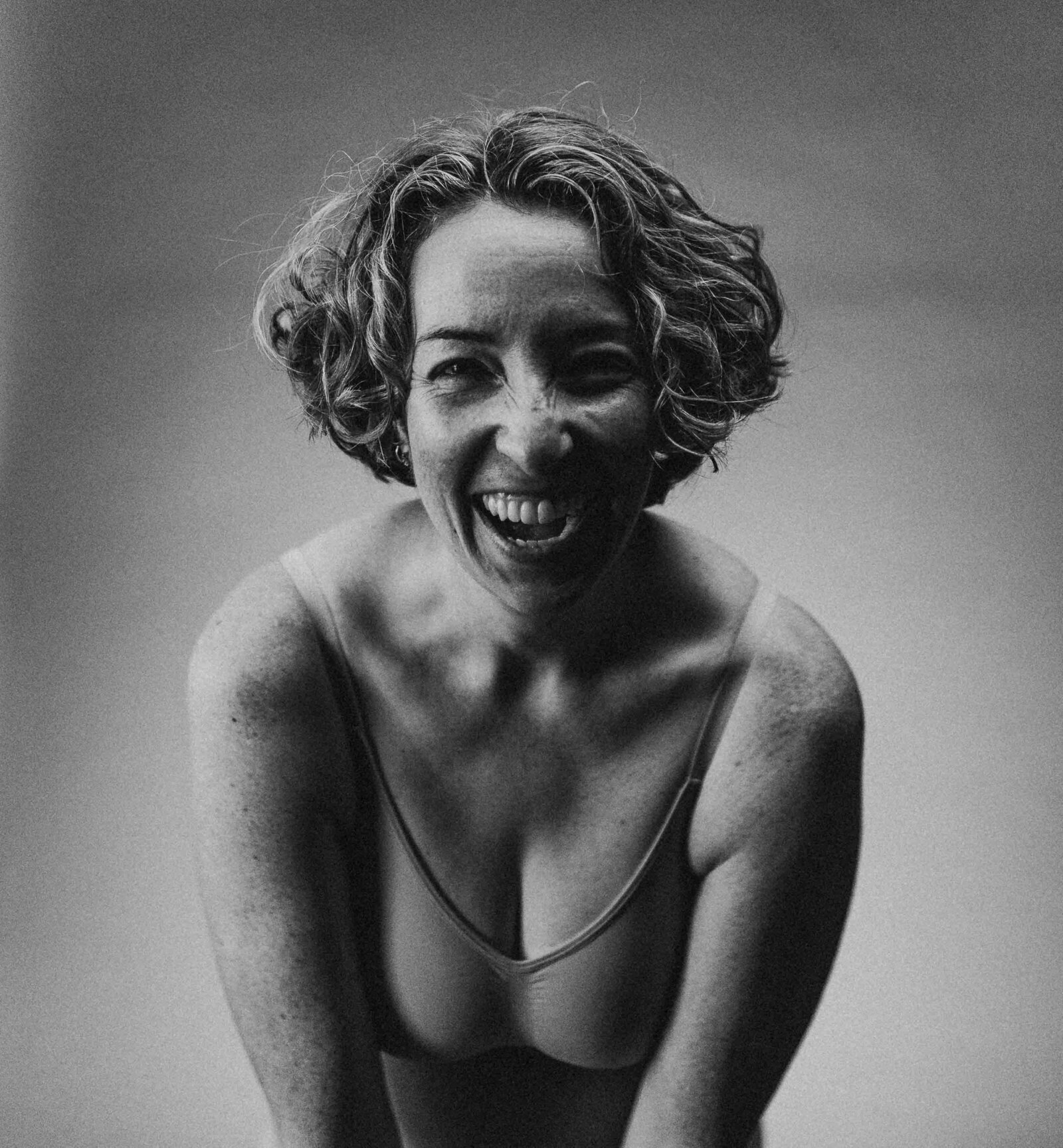 closeup photo of a laughing woman