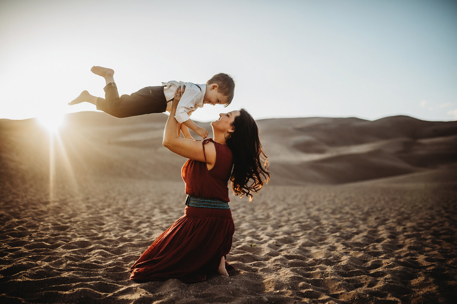 Family Photography, Mother lifting up little boy over her head