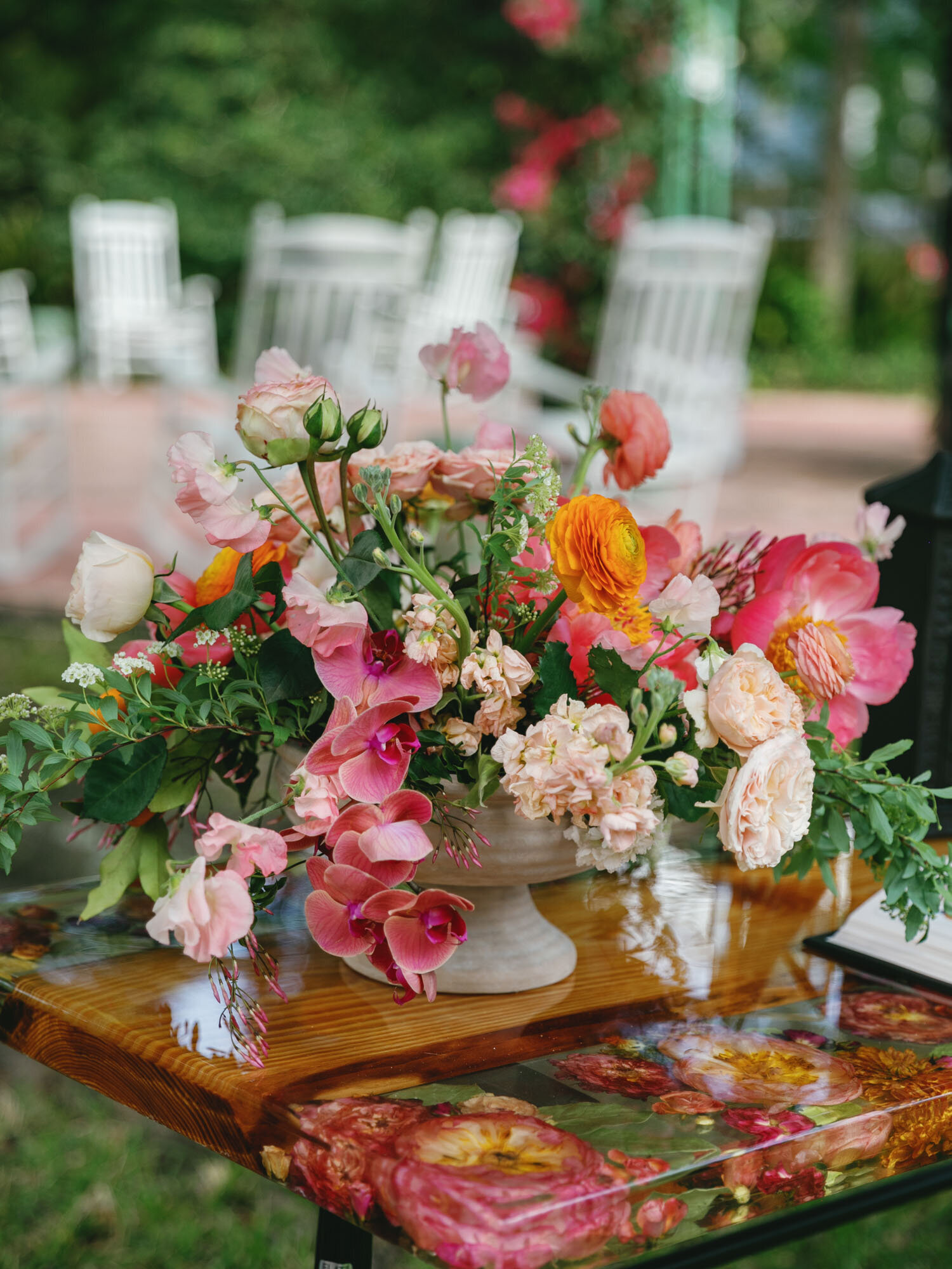 floral arrangement sitting on colorful floral table