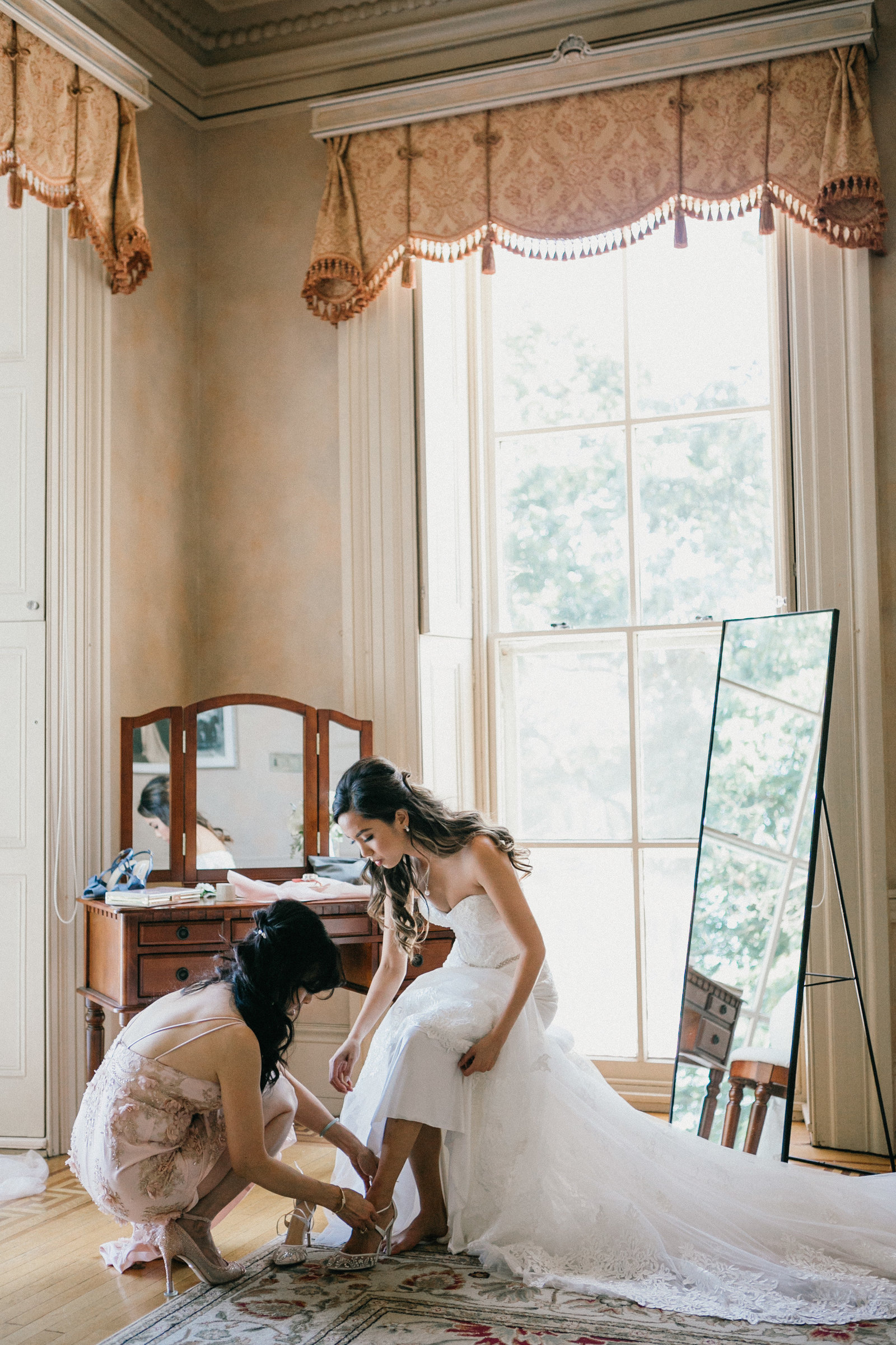 Gorgeous bride, Tascha getting ready in one of the rooms at the historic Glen Foerd Mansion in Philadelphia.