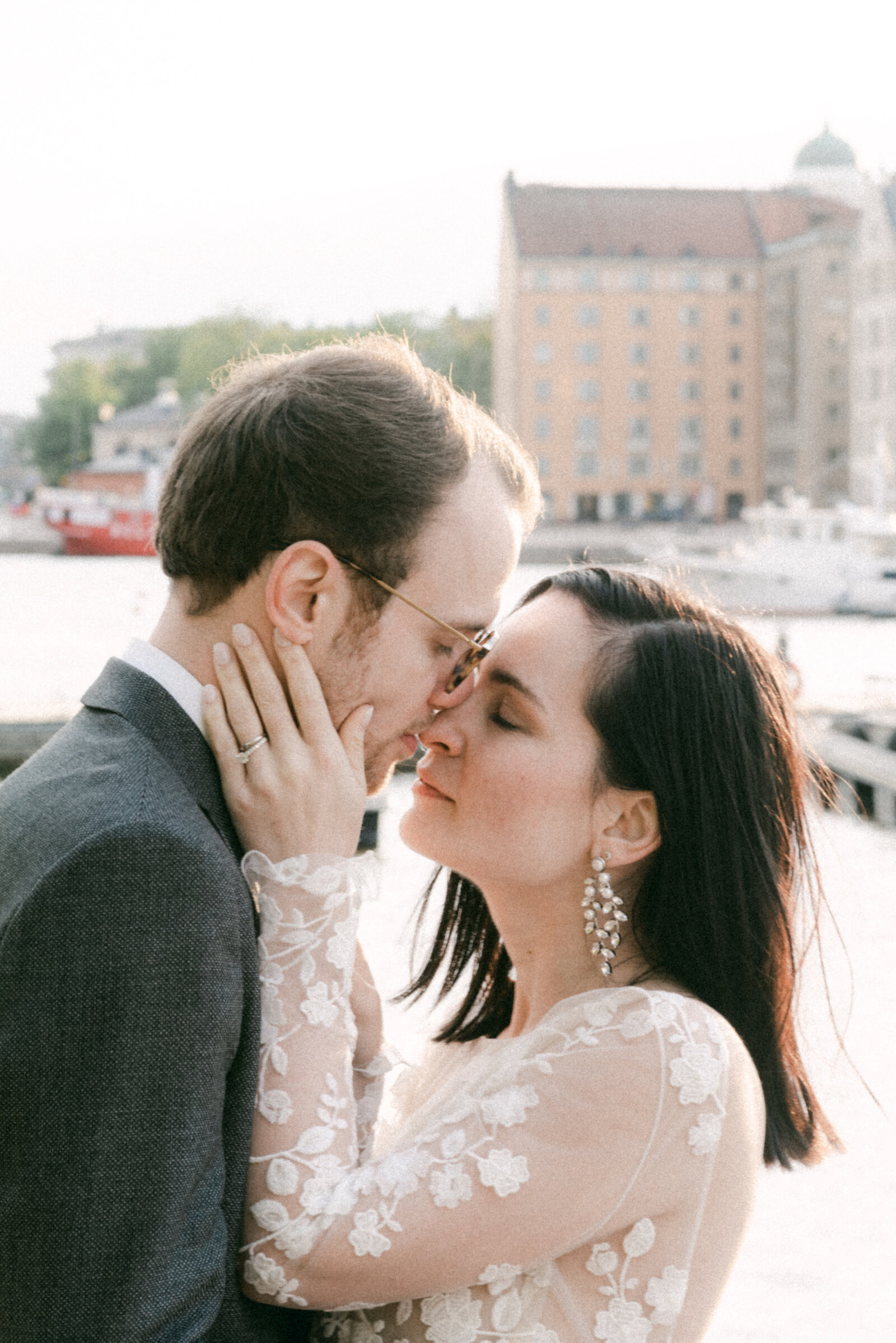 A wedding couple about to kiss in a seaside elopement photograph by Finnish wedding photographer Hannika Gabrielssonwedding photographer Hannika Gabrielsson.