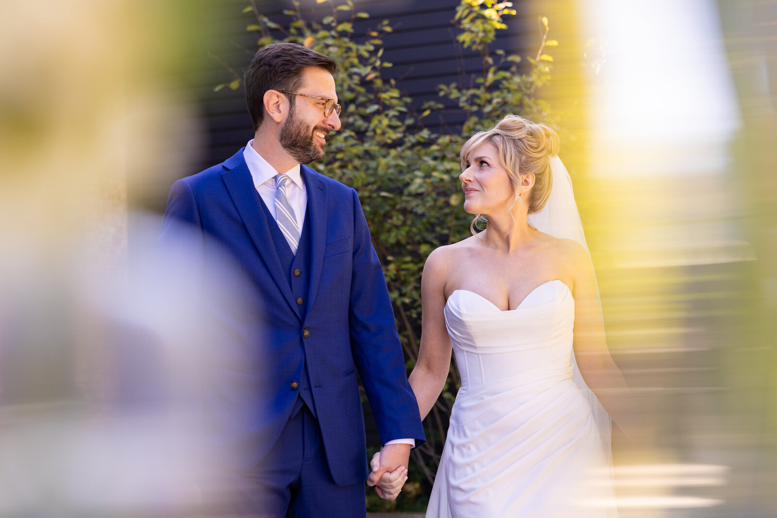 Cleveland bride and groom share in a candid and genuine moment behind The Old Courthouse in Cleveland Ohio on their wedding day. Photo taken by Aaron Aldhizer