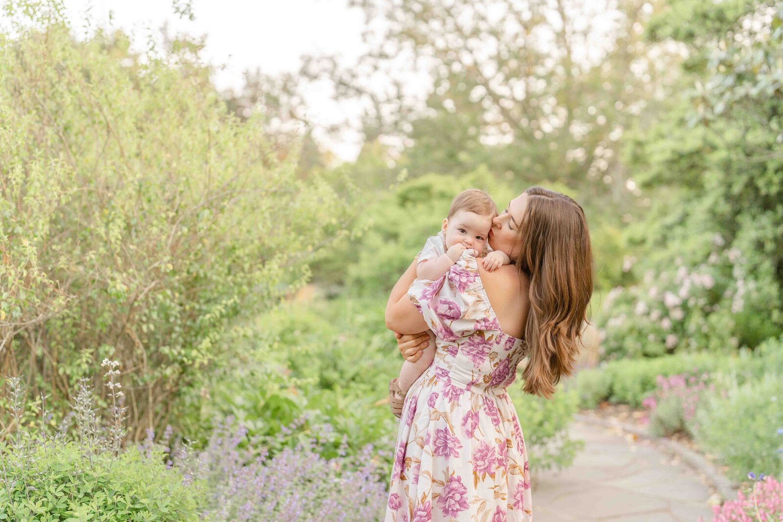 mom kissing baby during spring minis in Chantilly, Virginia
