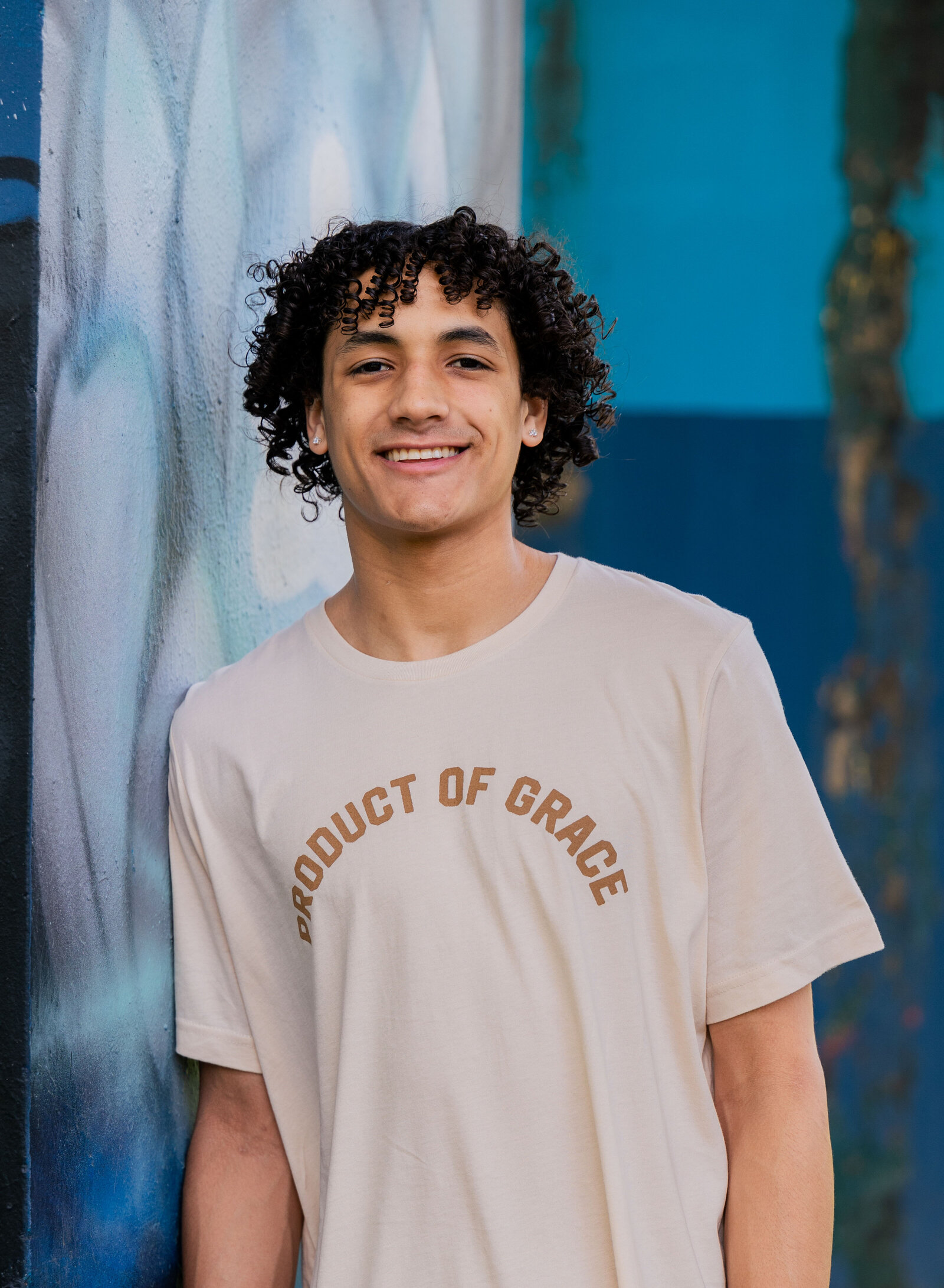 senior boy with colorful walls