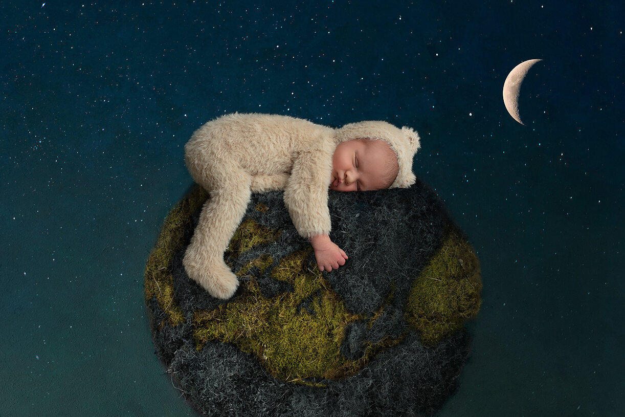 Newborn boy on top of the world.