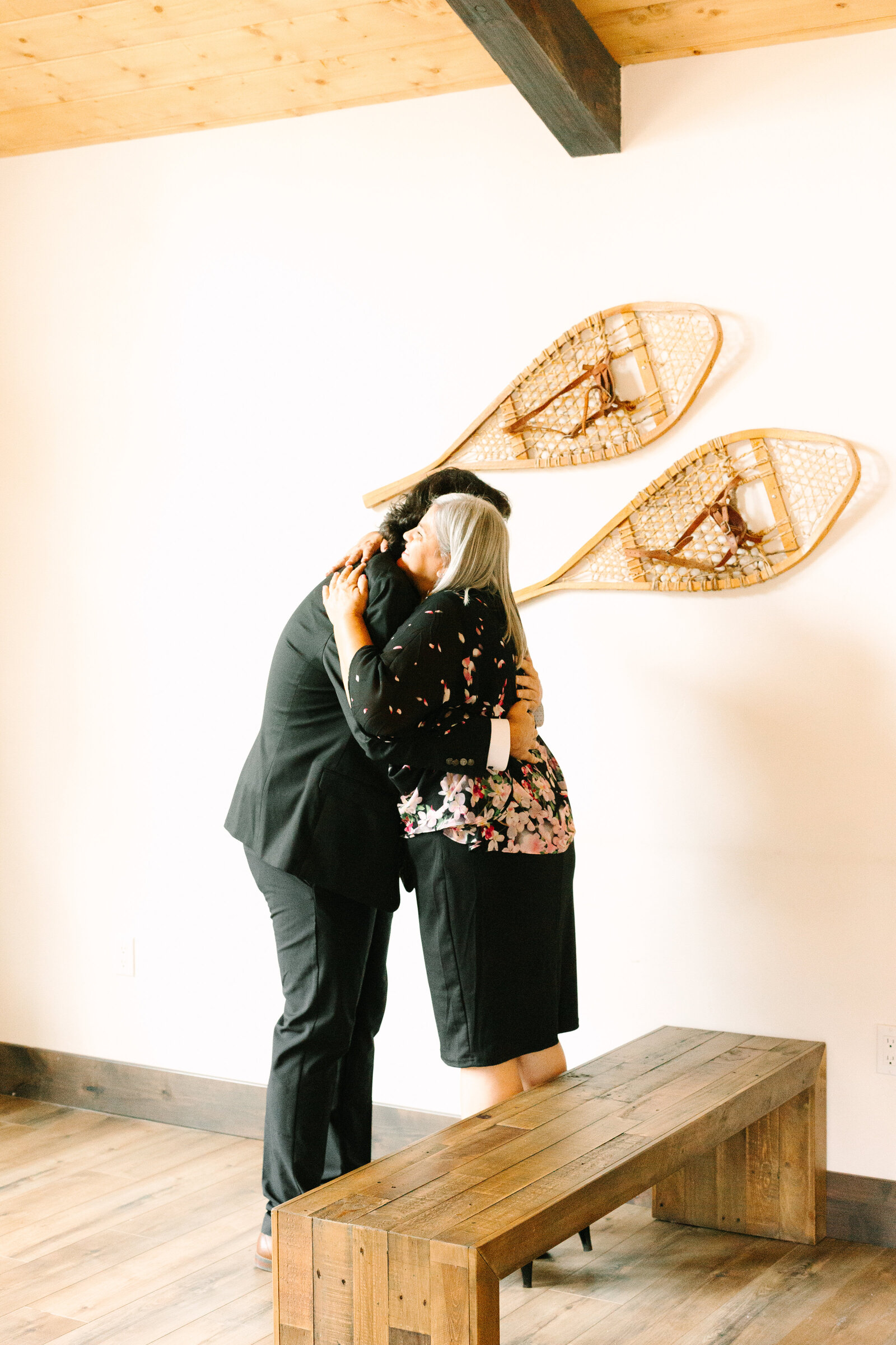 A couple celebrates their intimate elopement at a cabin at Big Bear Lake, California.