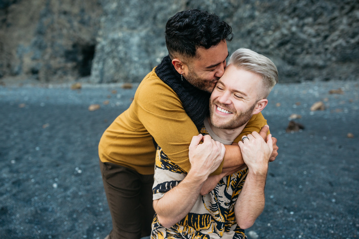 gay couple engagement photos in iceland black sand beach