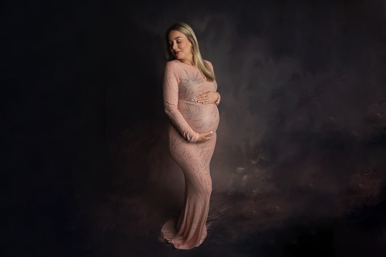 pregnant woman in beautiful gown
