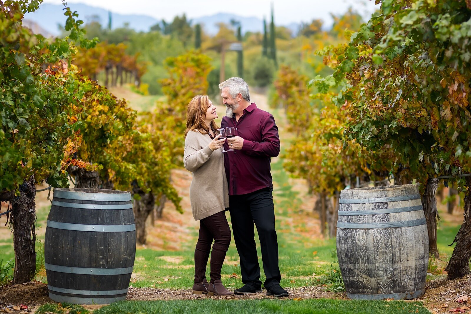 Portrait of couple drinking wine at a Temecula Vinyard
