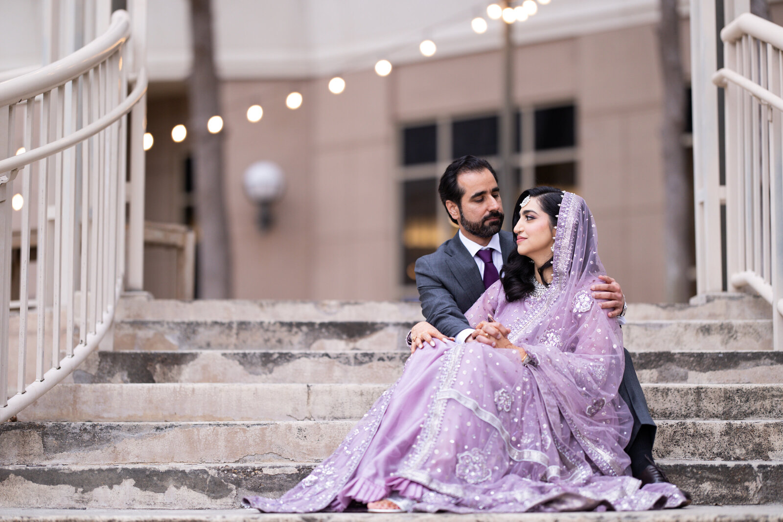Bride-and-groom-sitting-on-stairs-portarit