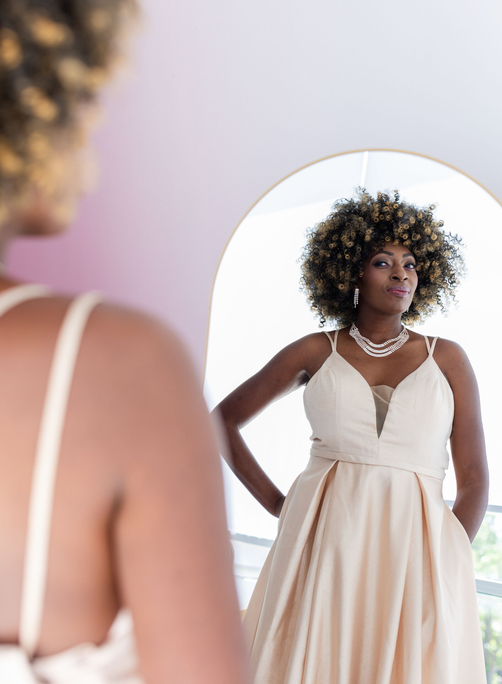 woman looking in the mirrow