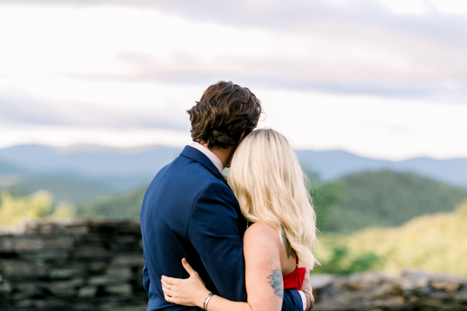 Couple looking out over the beautiful landscape captured by Staci Addison Reed