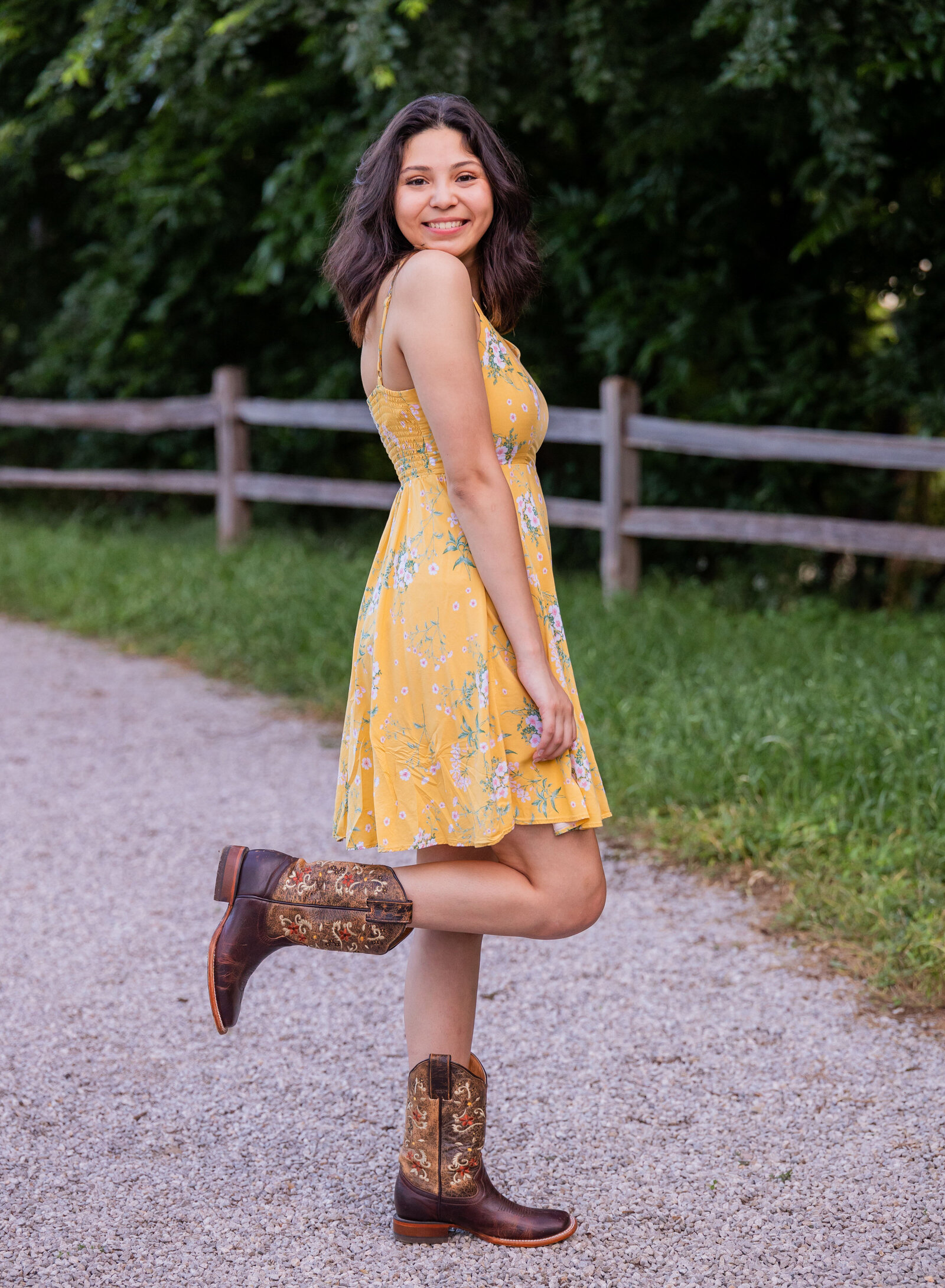 senior girl kicking up boot