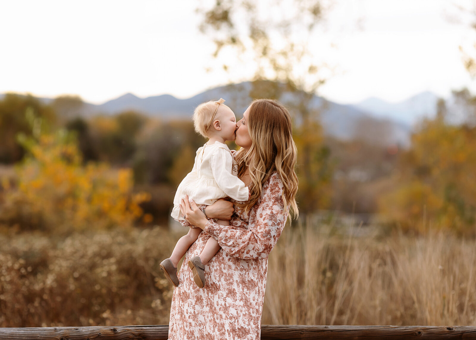 baby girl giving her mama kisses during colorado mountain photos