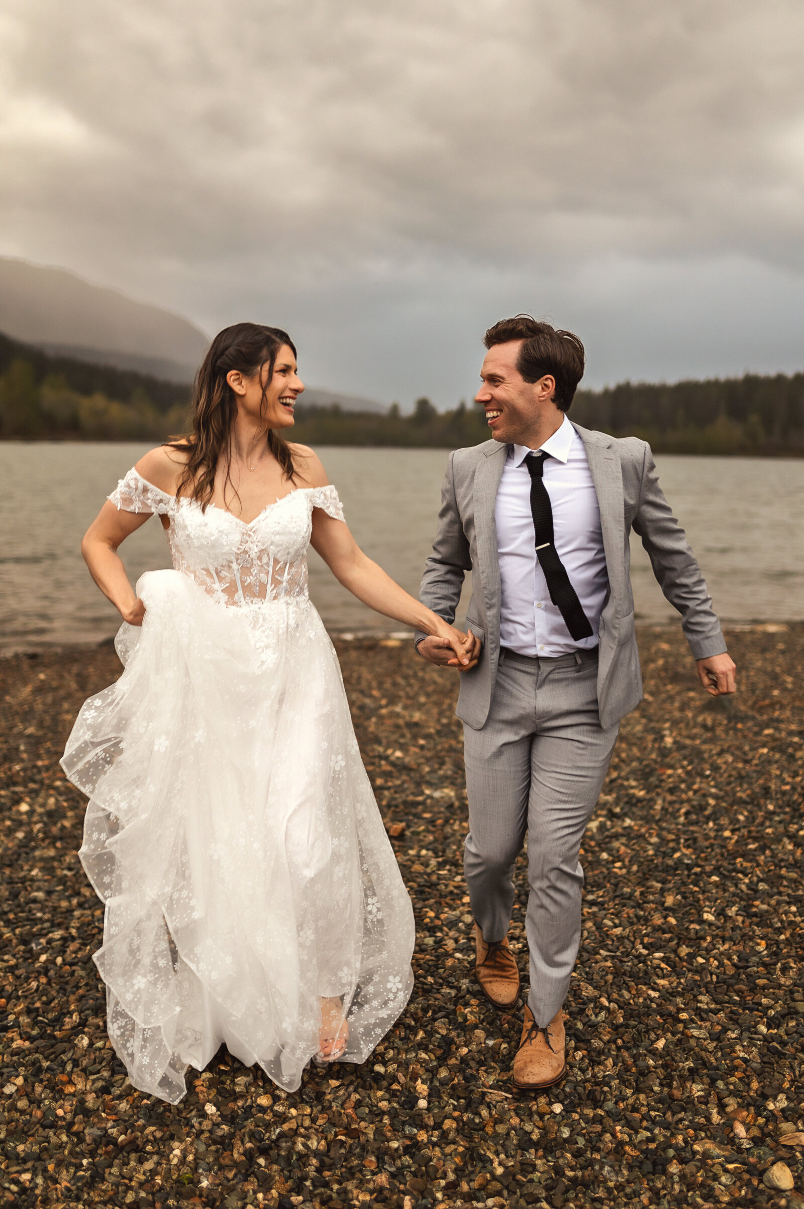 Stroll into your new life with stunning lakeside wedding photography by Everest Portraits in Western Washington. Our expert photography highlights your love against the majestic backdrop of tranquil waters and dramatic skies.
