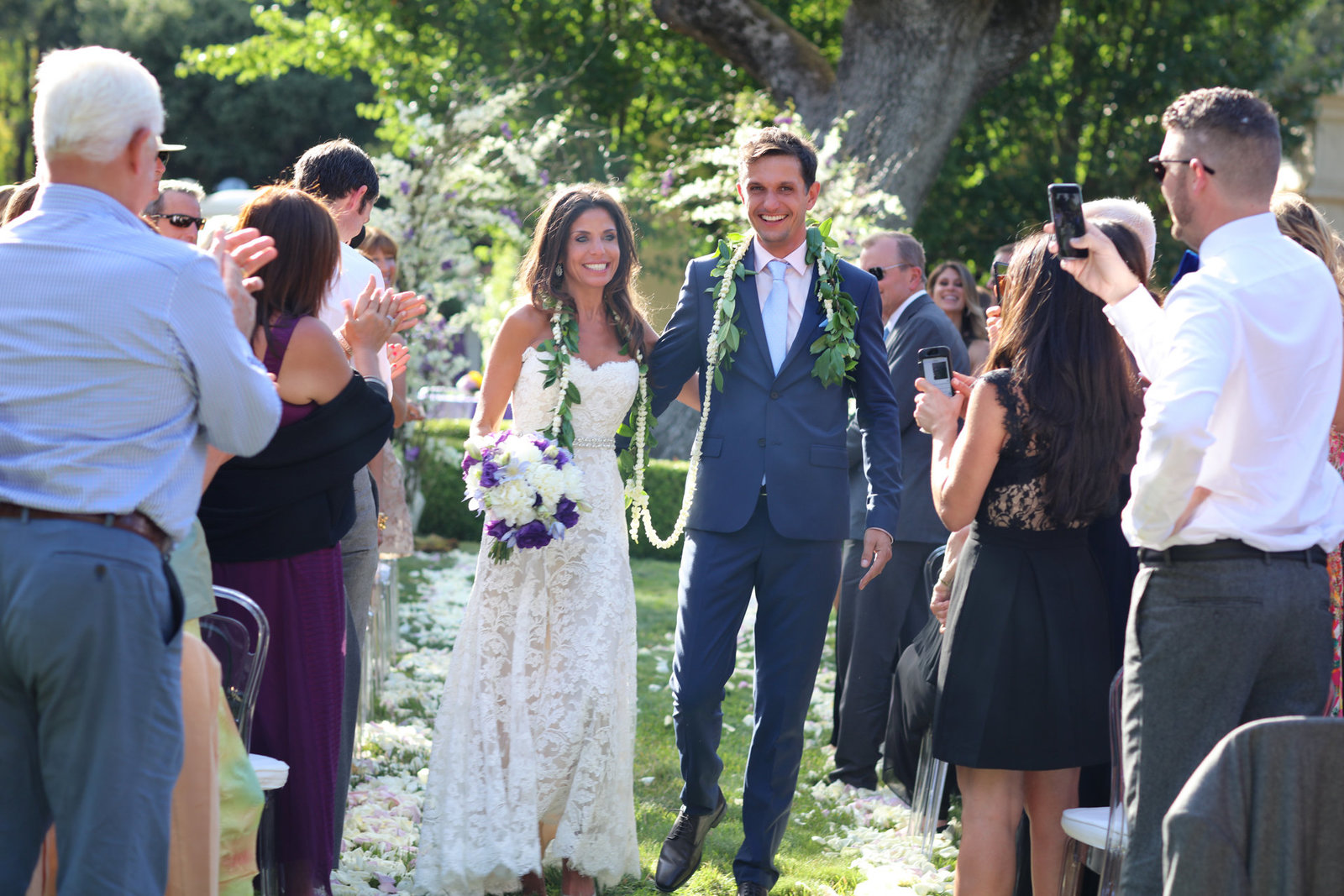 Bride and groom exit ceremony at beautiful Atherton wedding