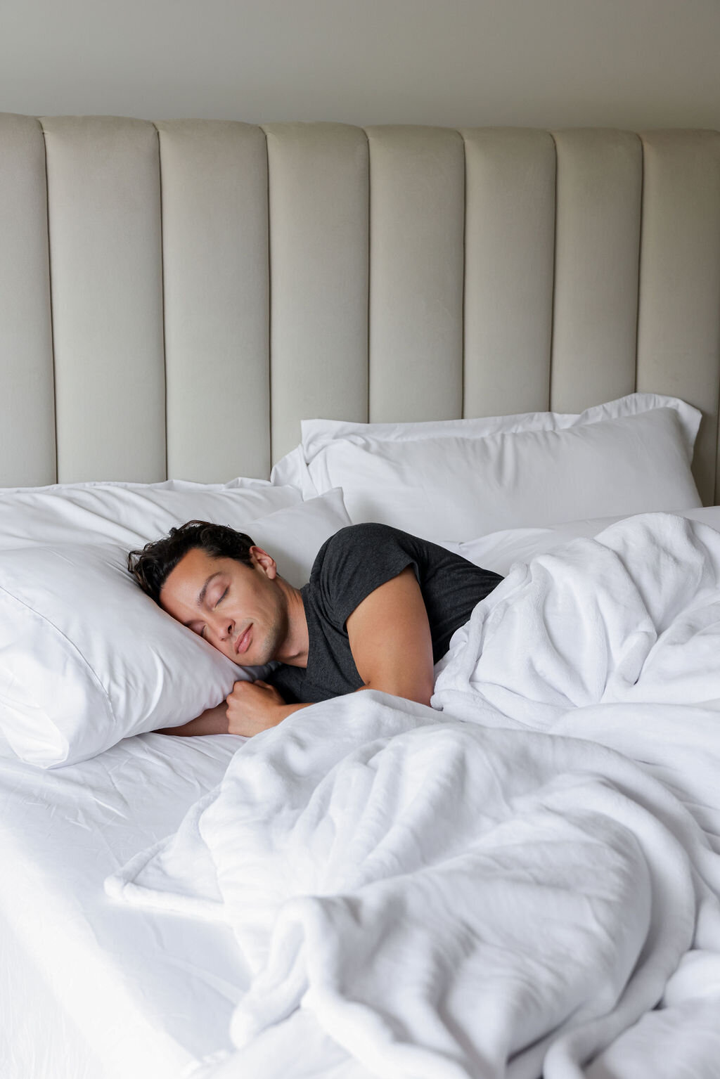 luxury hotel photographer social media marketing man sleeping in bed cozy
