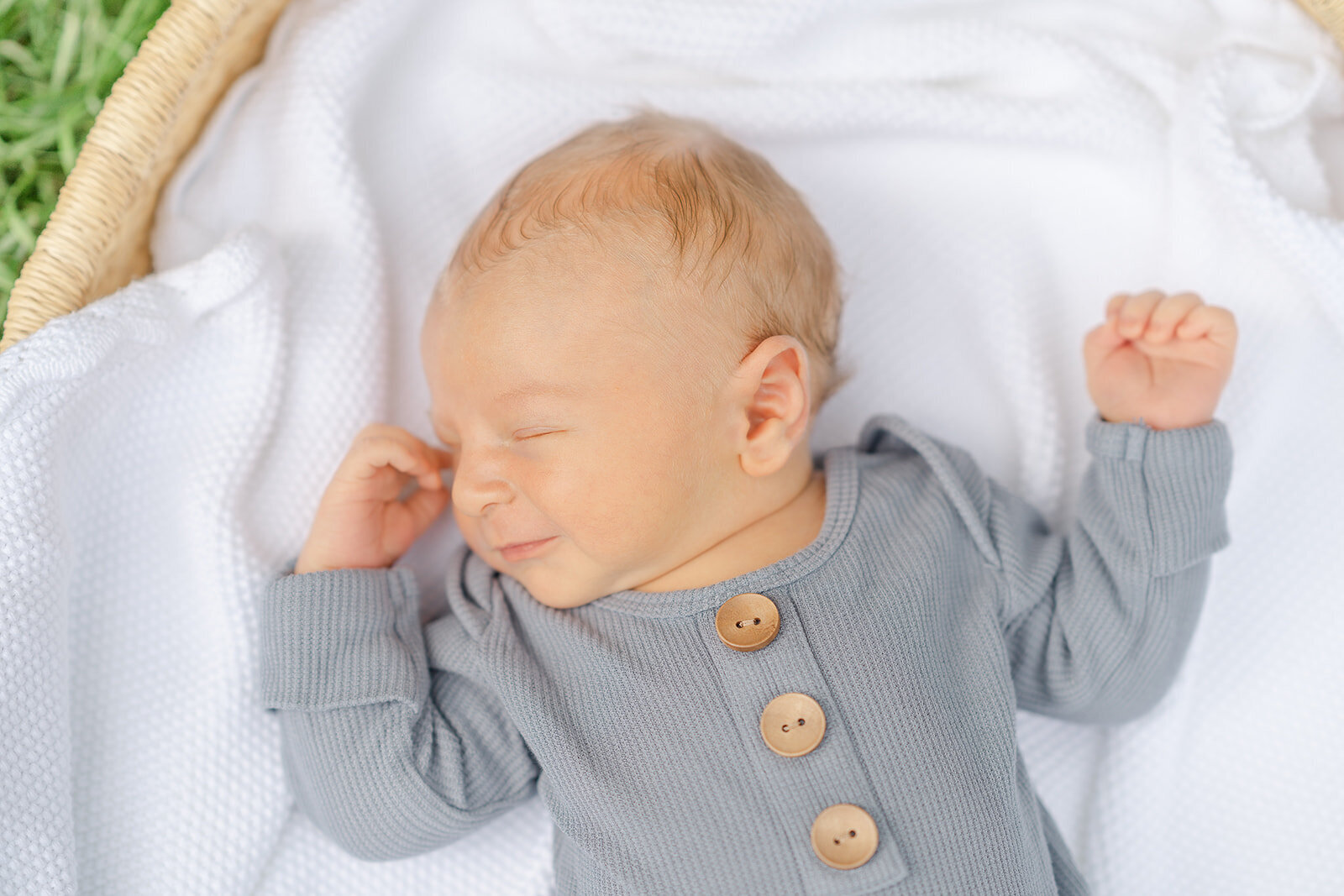 baby smiling while asleep, taken by TBP, a Loudoun, County, VA newborn photographer