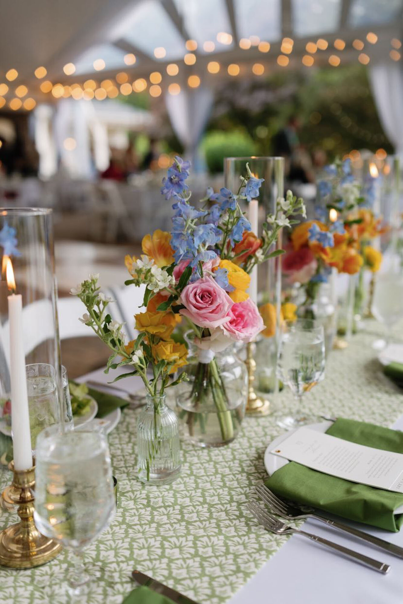 Small floral vases on table at North Carolina destination wedding