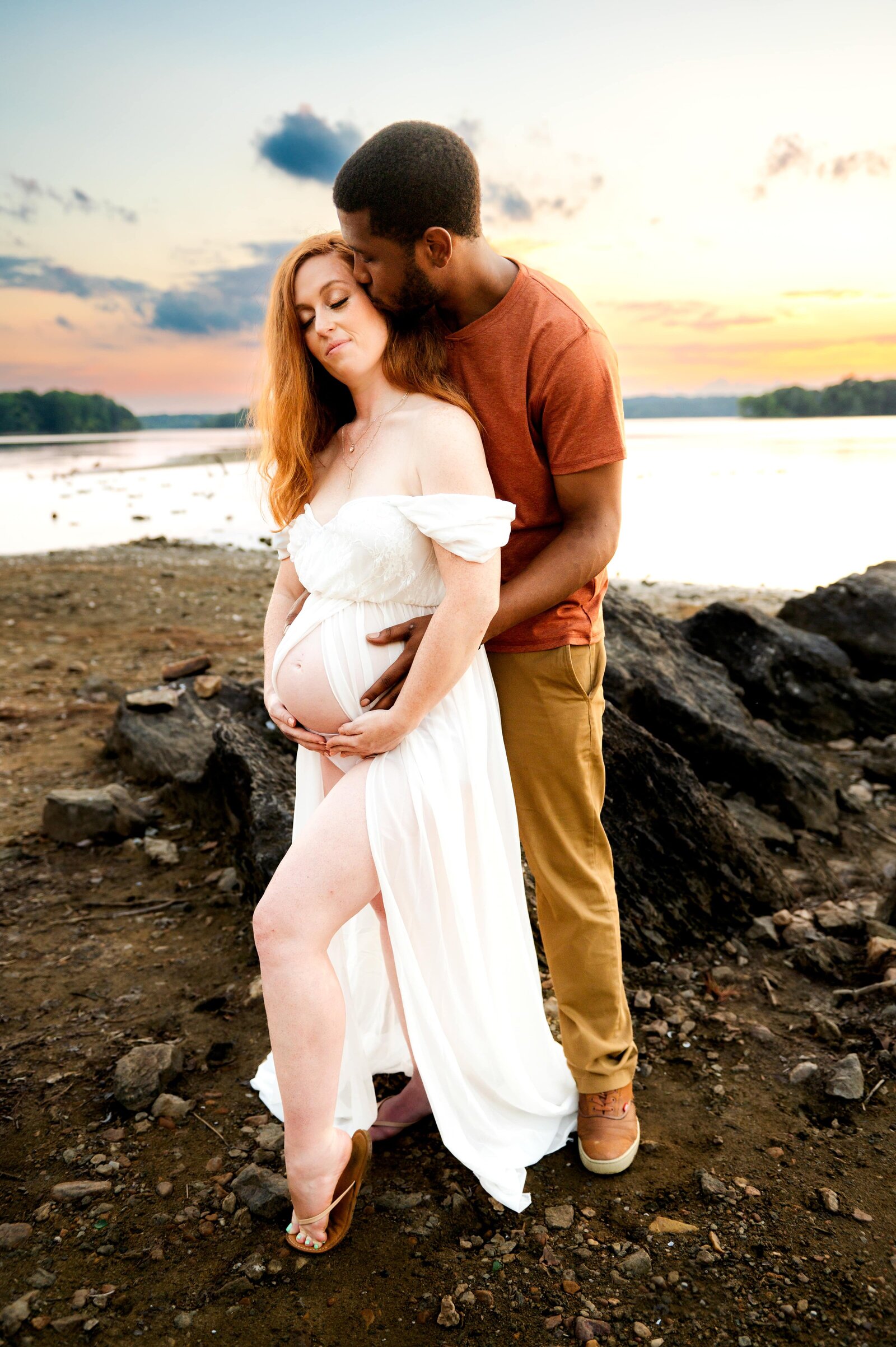 husband and wife during a maternity photoshoot at Loch Raven Reservoir