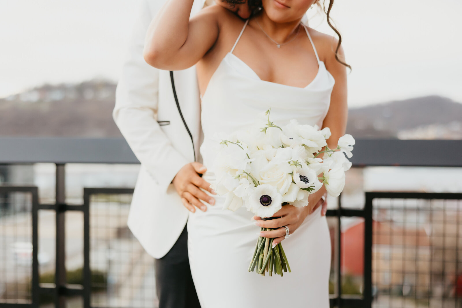 Hispanic Bride and Groom Posing on Rooftop in Pittsburgh, Pa with Wedding Bouquet