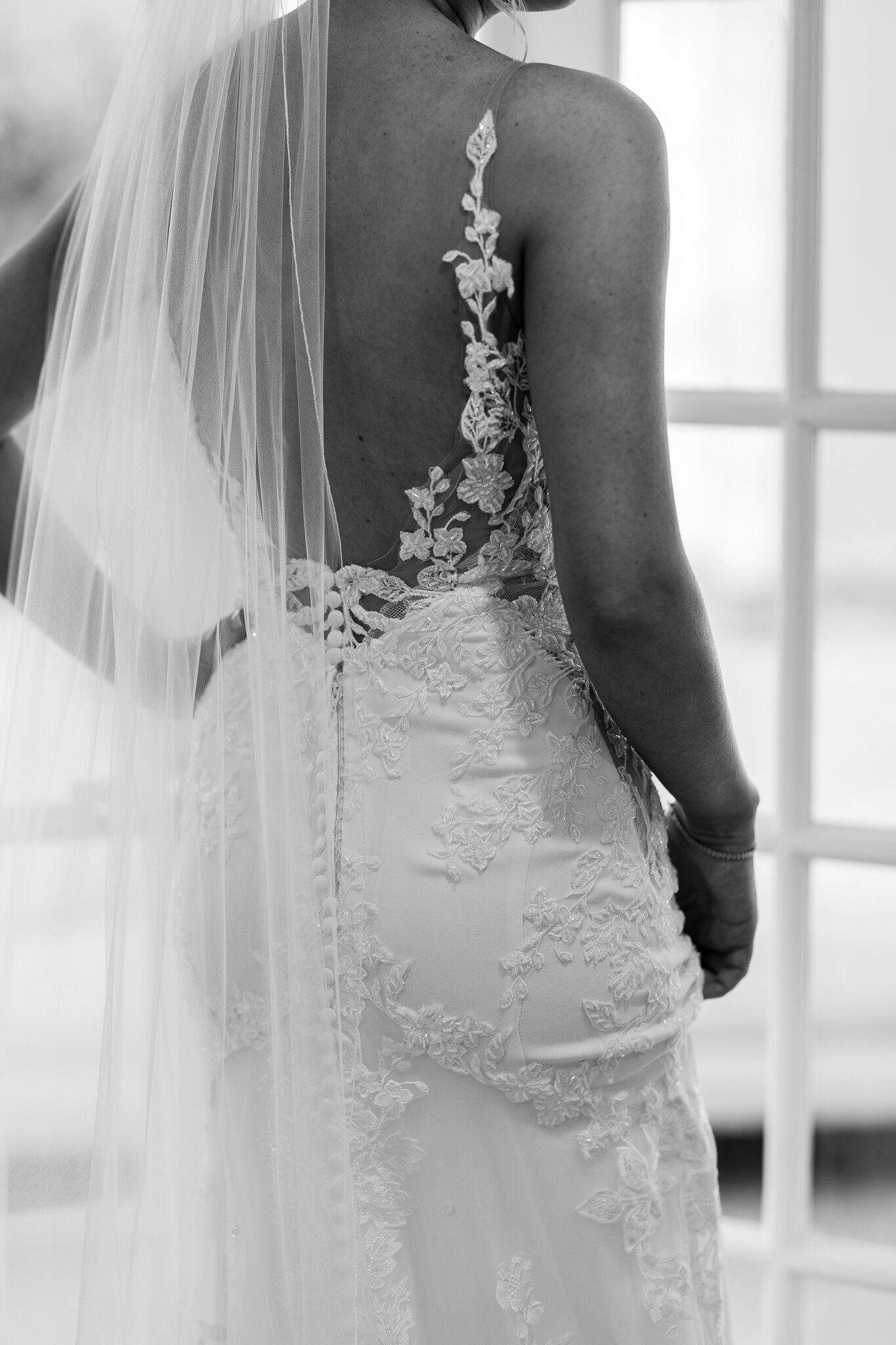 Intricate lace design on bride’s wedding gown photographed at SkyView Golf Club in Sparta, NJ

