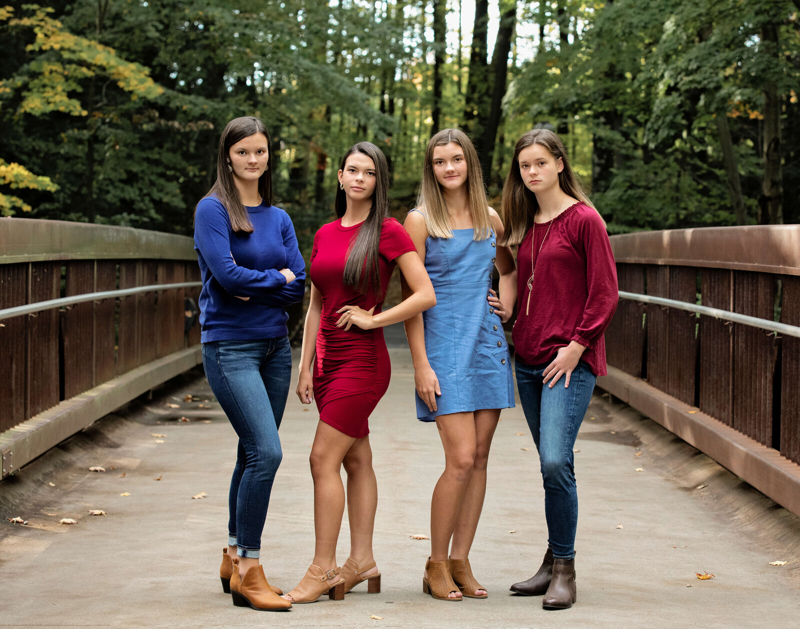 Photos of sisters standing on a bridge at Penn State Behrend campus in Erie Pa