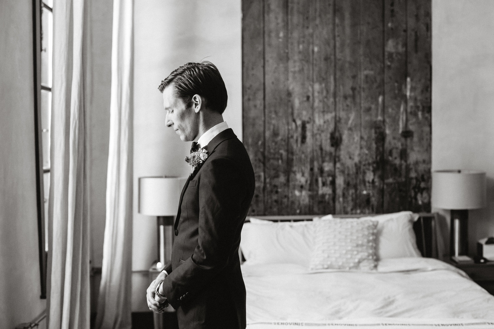 Powerful shot of the groom moments before seeing his bride for the first time at Lokal Hotel.
